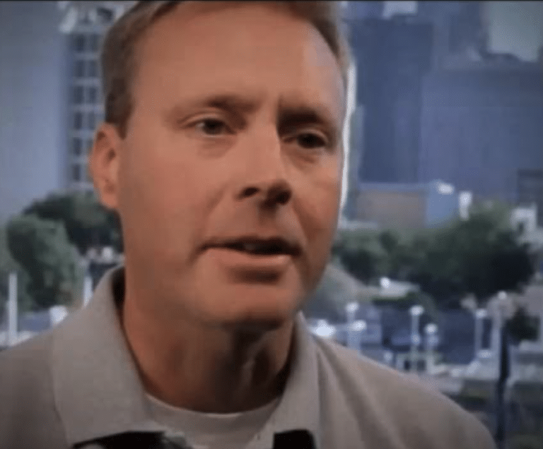 a man in a grey shirt